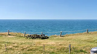 Strand in der Nähe von Narhval Poolhus