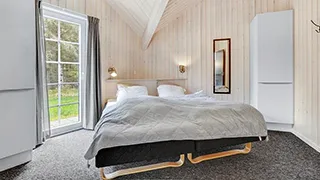 Schlafzimmer in Solsiden Poolhus