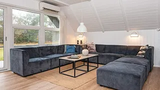 Wohnzimmer von Tættest på Stranden Hus