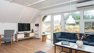 Wohnzimmer von Tættest på Stranden Hus