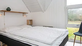 Schlafzimmer in Tættest på Stranden Hus