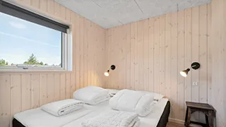 Schlafzimmer in Poolhus Tvismark
