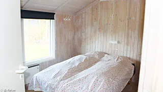 Schlafzimmer in Pøt Strandby Hus