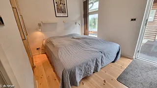 Schlafzimmer in Tjørne Mosaikhus