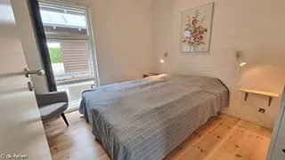 Schlafzimmer in Tjørne Mosaikhus