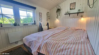 Schlafzimmer in Helles Feriehus