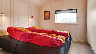 Schlafzimmer in Sommerfugl Poolhus