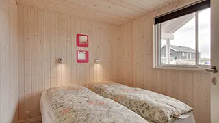 Schlafzimmer in Hejmdals Poolhus