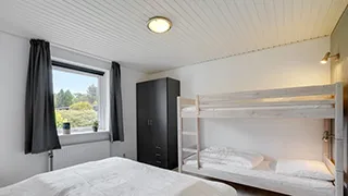 Schlafzimmer in Ahorn Poolhus